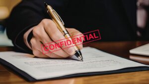 Person securely signing a confidential document using EdocSign.